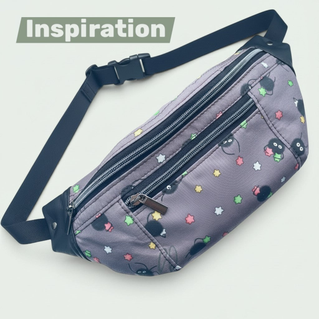 Schneckenschmiede Bauchtasche mit grauem Stoff, bunten Sternen und Rußmännchen-Motiv, verstellbarem Gurt und Reißverschlüssen