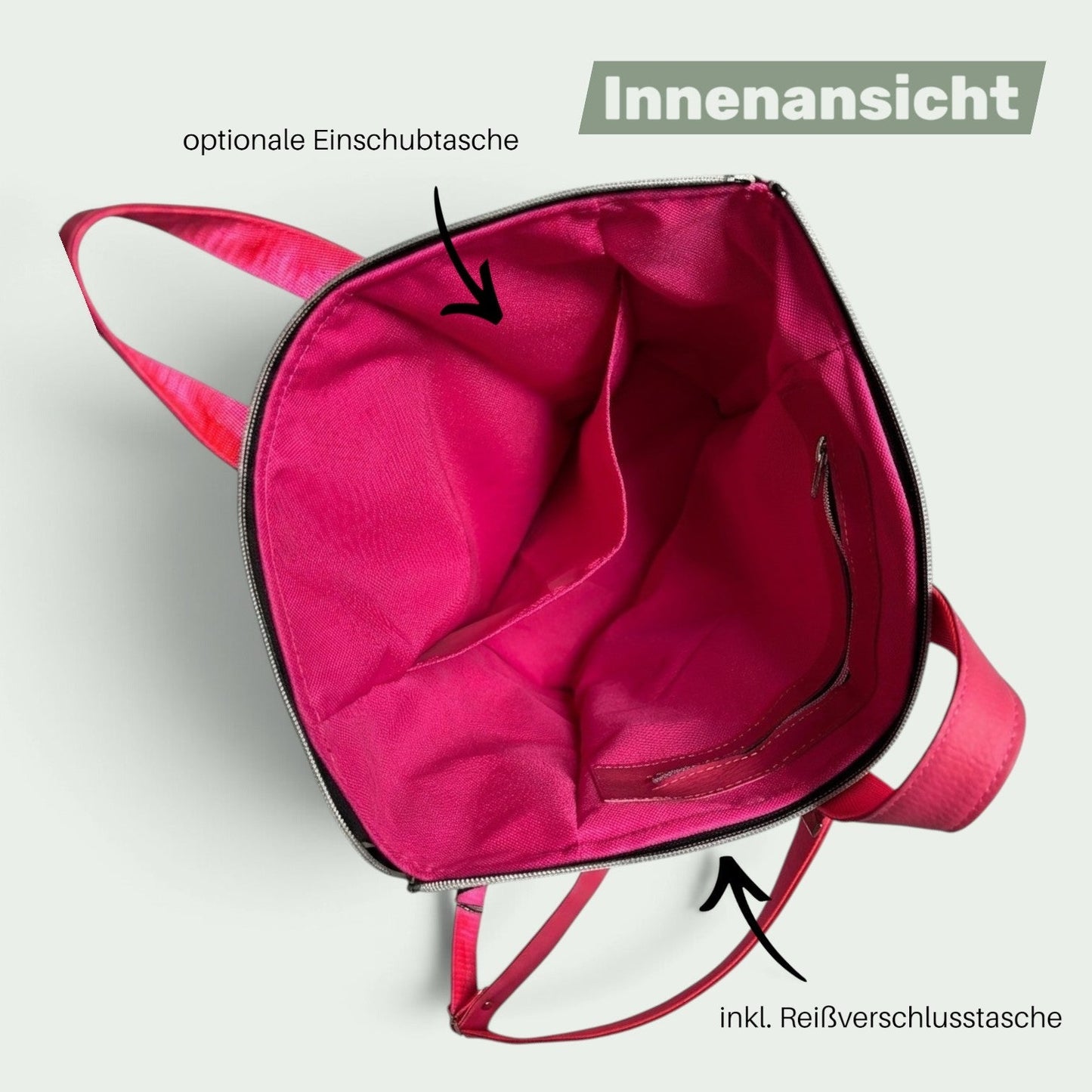 Schneckenschmiede ITA Rucksack Innenansicht mit pinkem Innenfutter, Einschubtasche und Reißverschlussfach.
