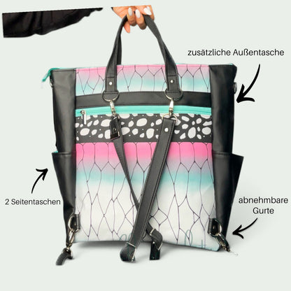 Schneckenschmiede 2-in-1 Rucksack aus Kunstleder mit buntem Muster, abnehmbaren Gurten und praktischen Außentaschen.