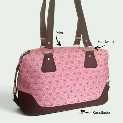 Schneckenschmiede Brooklyn Umhängetasche in Rosa mit geometrischem Muster, braunen Kunstleder-Akzenten und Metallringen