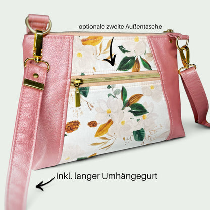 Schneckenschmiede Umhängetasche Sunshine mit Blumenmuster, rosa Kunstleder-Akzenten, Reißverschluss und verstellbarem Gurt.
