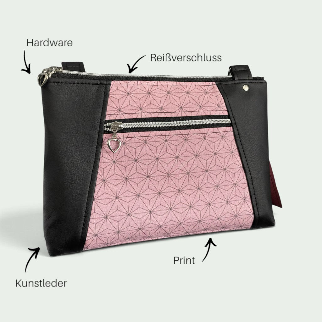Schneckenschmiede Umhängetasche Sunshine mit rosa geometrischem Muster und schwarzen Kunstleder-Akzenten