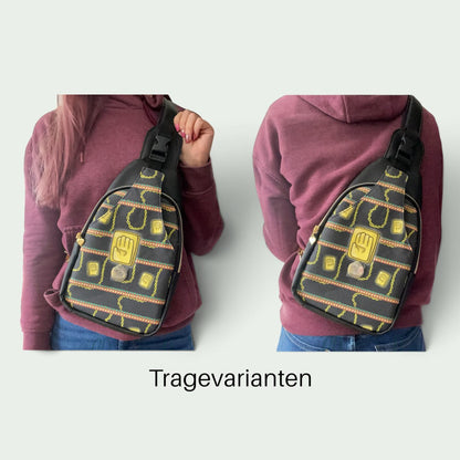 Schneckenschmiede Wayfarer Sling Bag mit individuellem Ketten-Muster, getragen als Cross-Body-Tasche vorne und hinten.